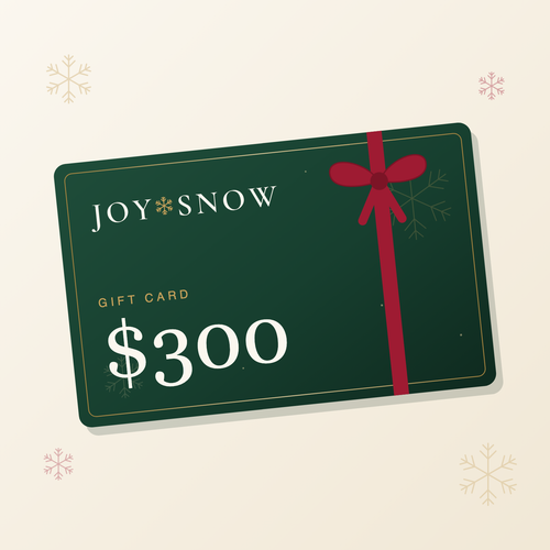 Joy Snow gift card, $300 — green card with gold snowflake and red ribbon